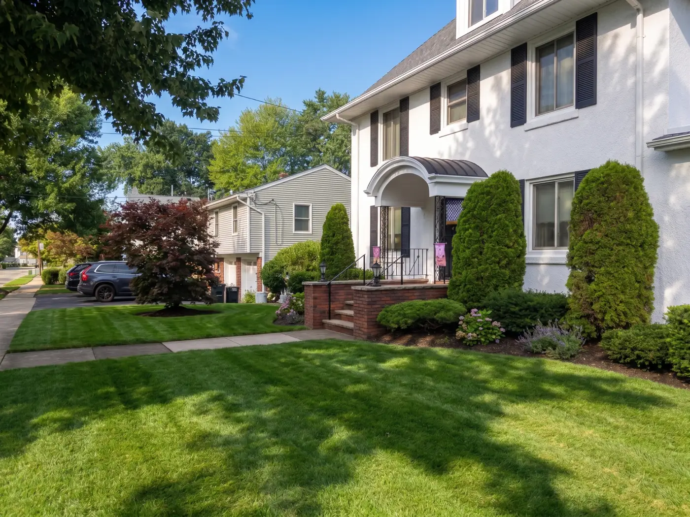 Clean-edged lawn and sidewalk after a visit